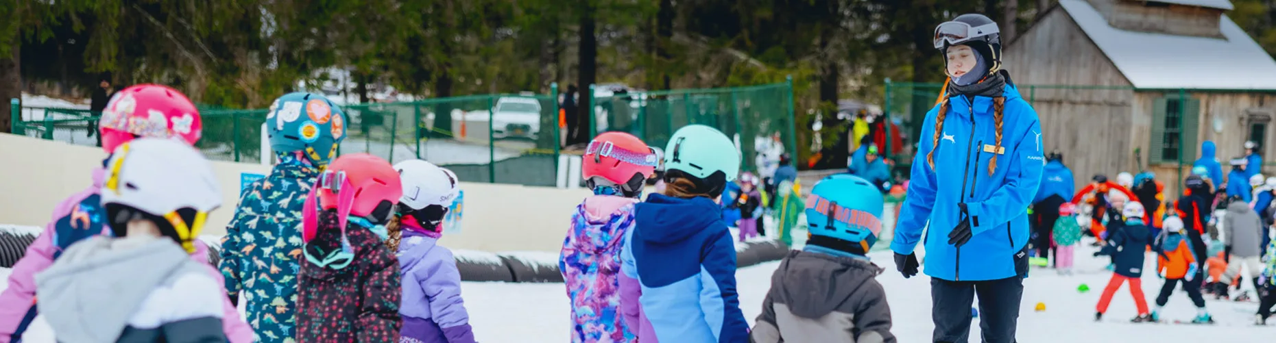 Group of youth skiers in a lesson at Jiminy Peak